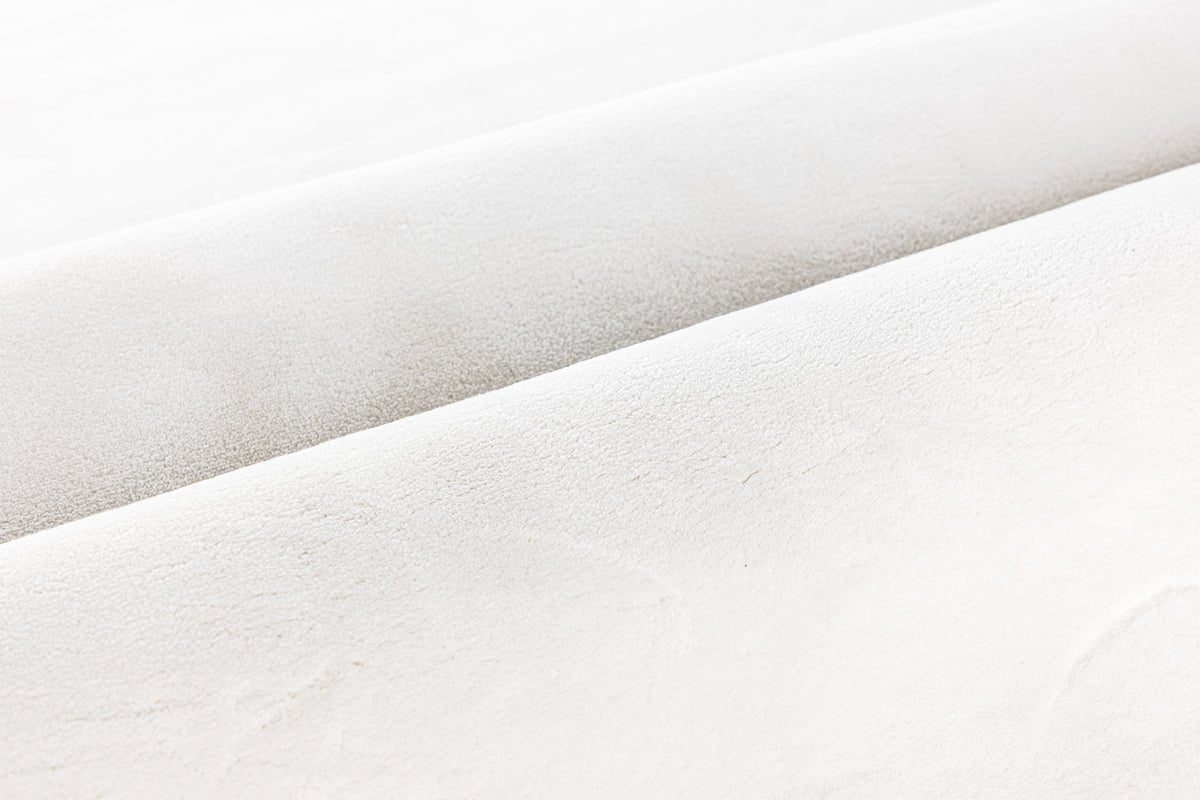 Tæppe Liora – i Hvid af polyester & nonwoven stof