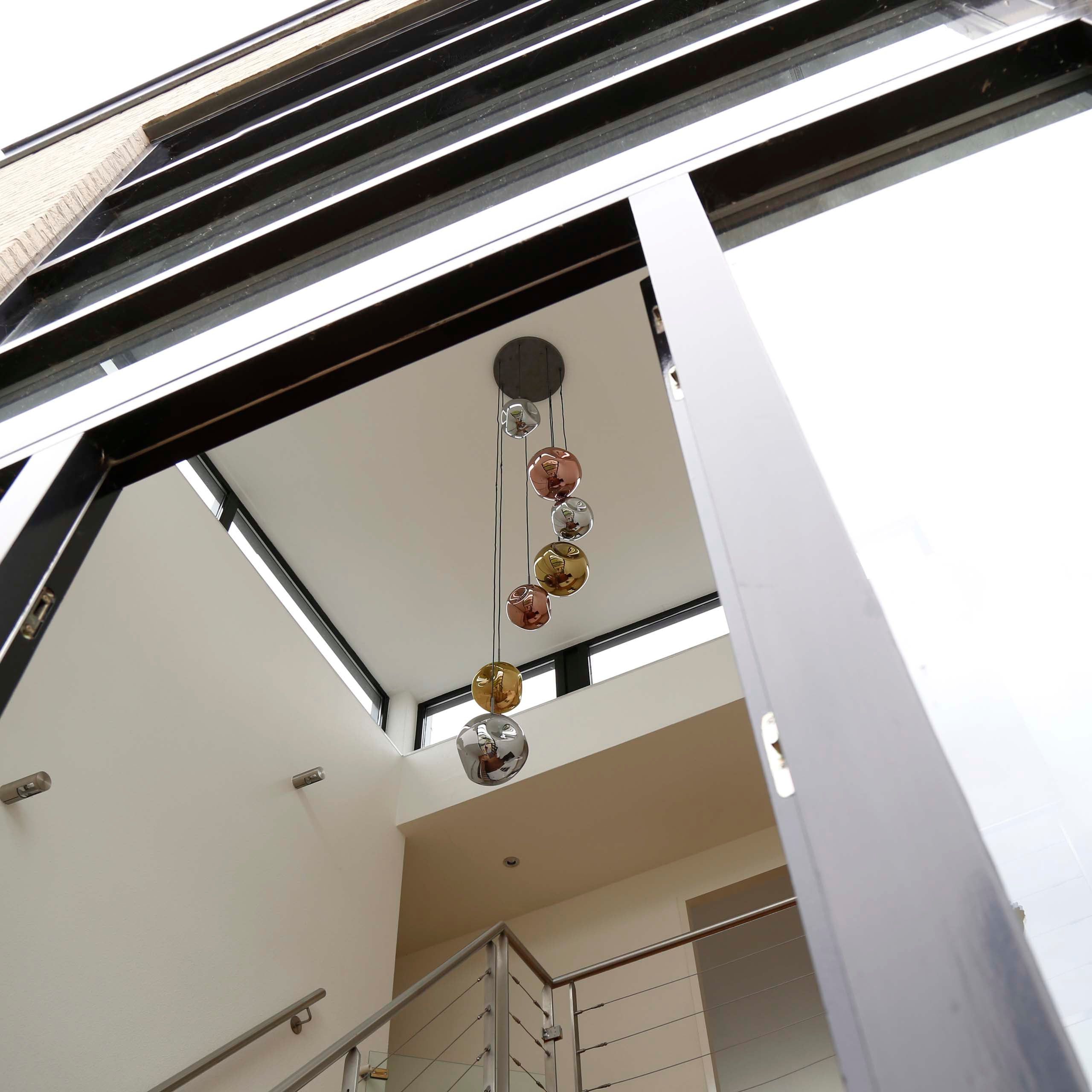 Pendellampe „Elaris“ – 7 lamper i trin i metalfarvekombinationen guld, kobber og krom